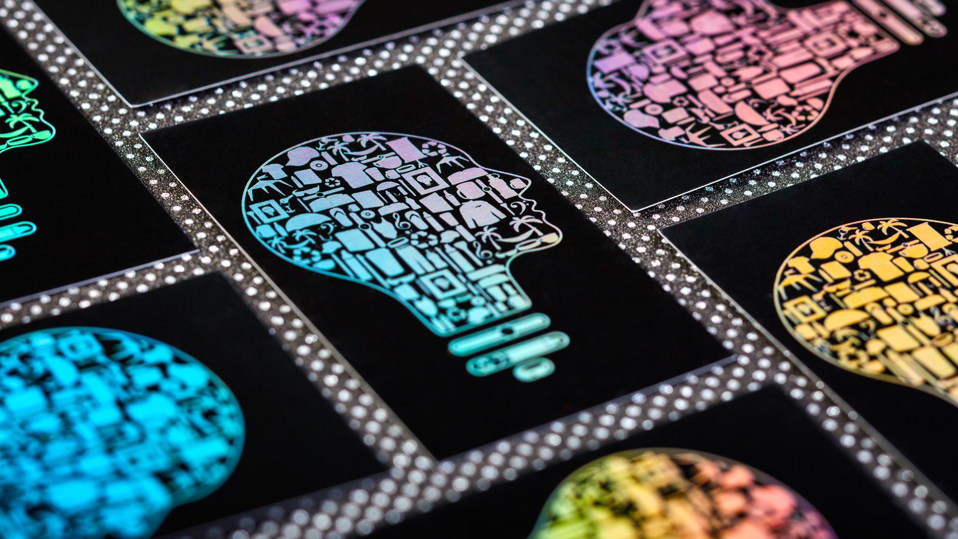 Business cards with standard weight and size and rainbow silver foil.