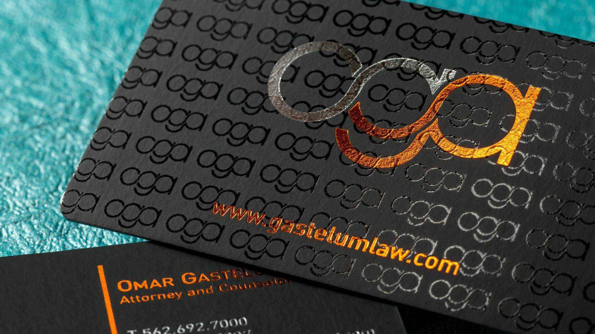 Rounded corners to accentuate the look of these onyx suede business cards with silver+orange foil and spot uv.