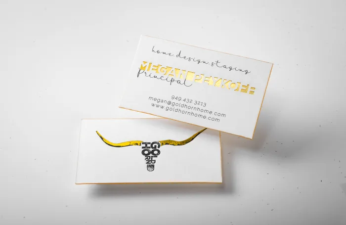White silk home design staging cards for Gold Horn Home feature gleaming gold foil lettering, a gold steer skull graphic, and metallic gold edges.