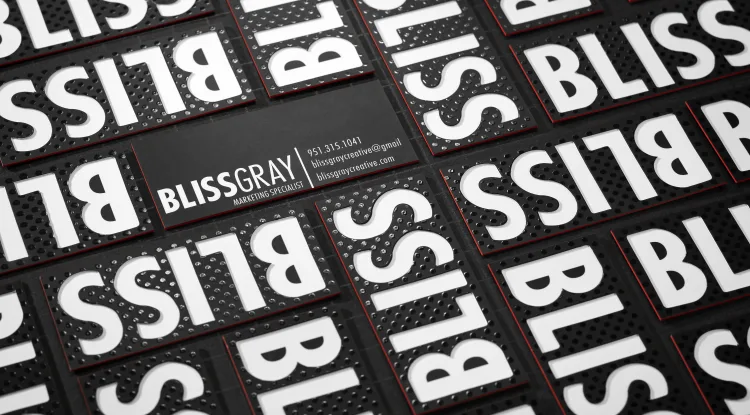 Black silk cards for Bliss Gray Marketing Specialist feature raised spot UV patterns and white lettering.
