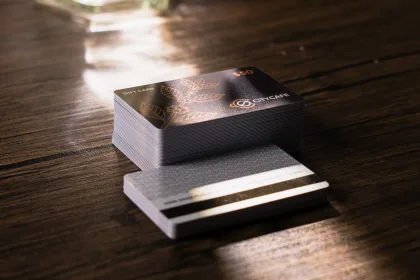 A frosted plastic membership card with metallic accents.