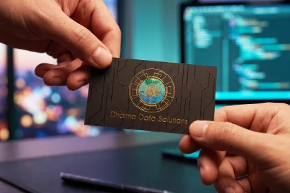 A premium business card passed hand to hand in a meeting.