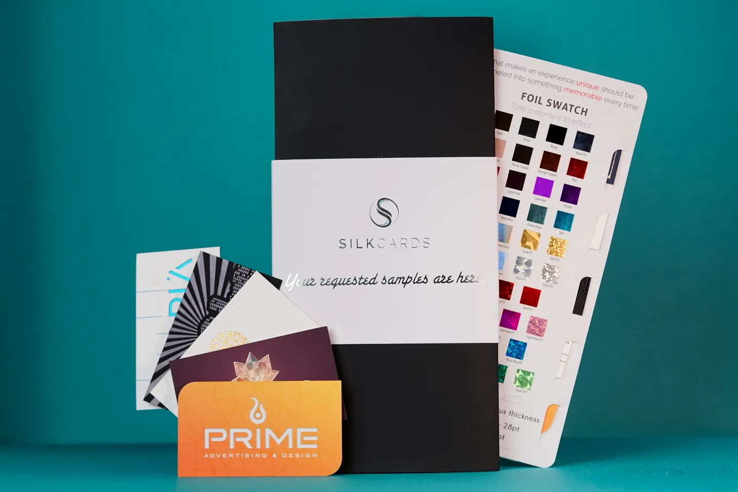 The SilkCards sample kit arranged on a branded blue background.